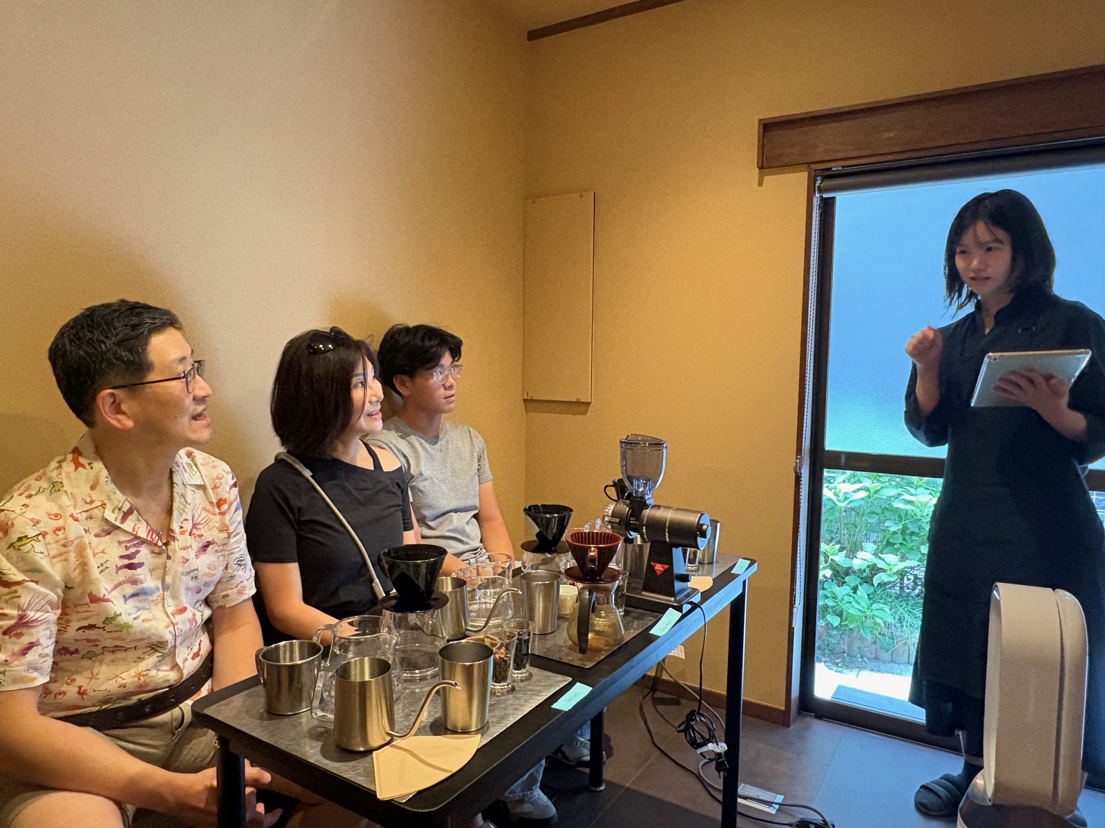 The Master talking to guests at the start of the coffee workshop