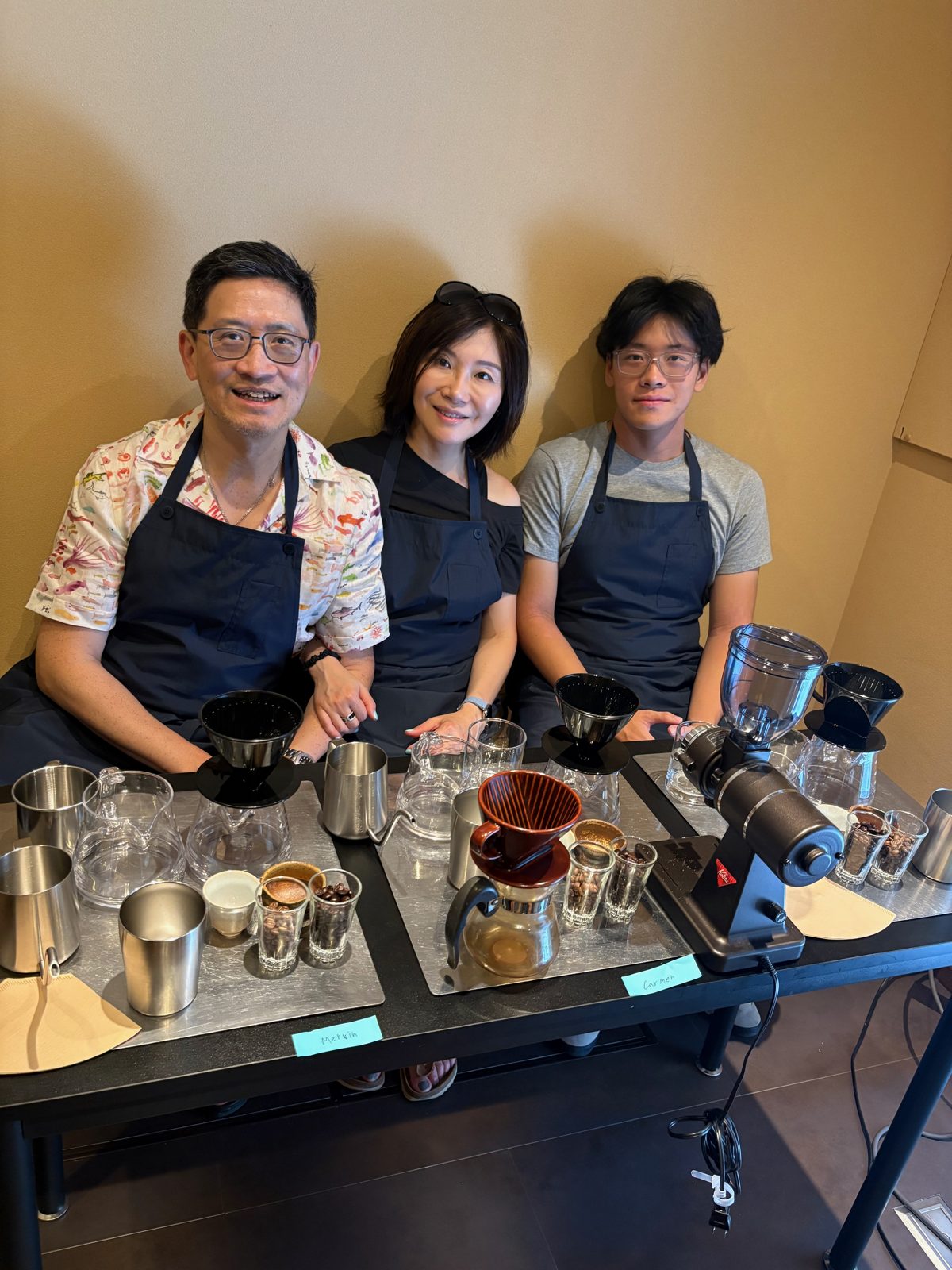 Guests at the workshop table, each with their own brewing station