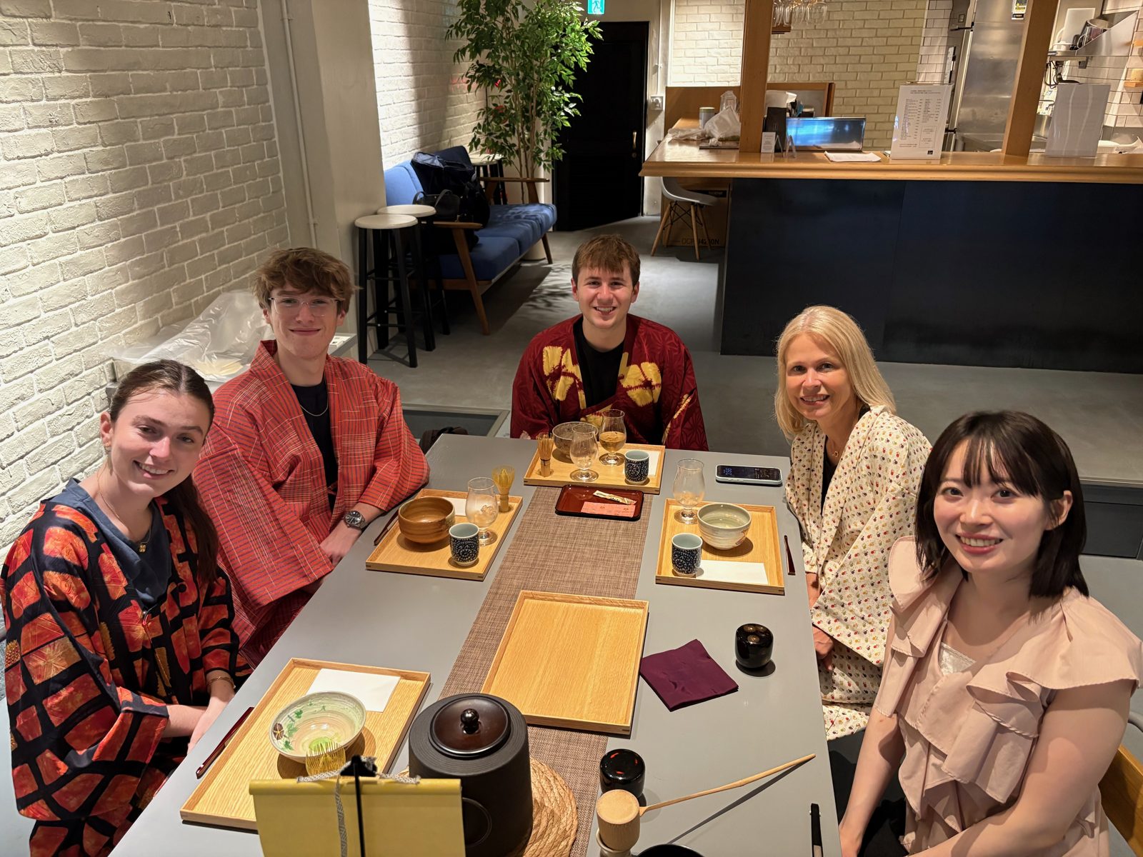 Guests and sensei posing for a group photo after the tea ceremony