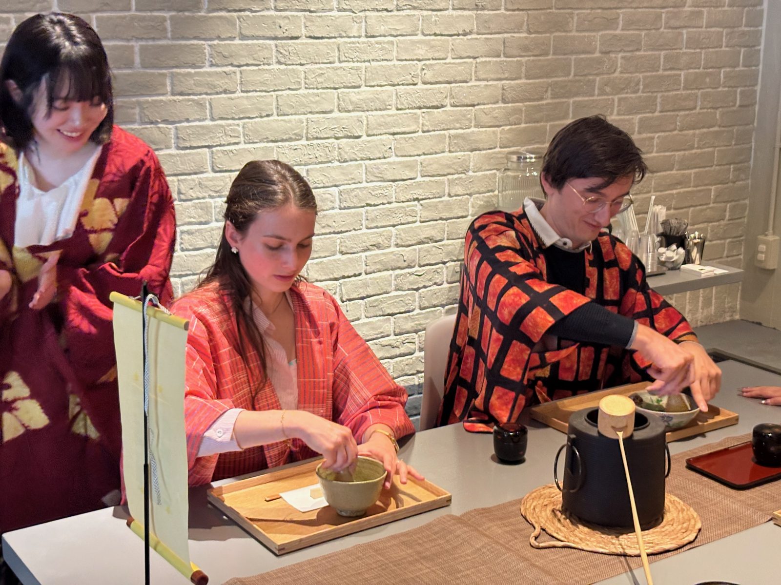 Guests whisking their own bowls of matcha