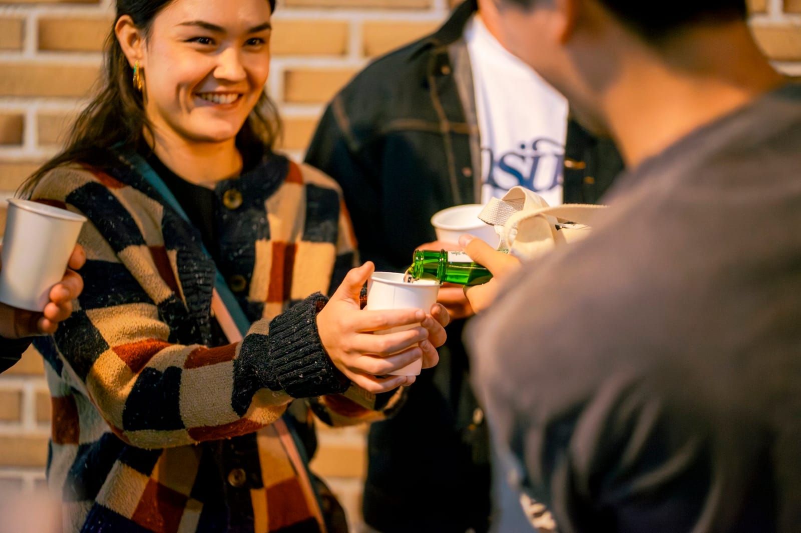 Sake being poured at a local bar