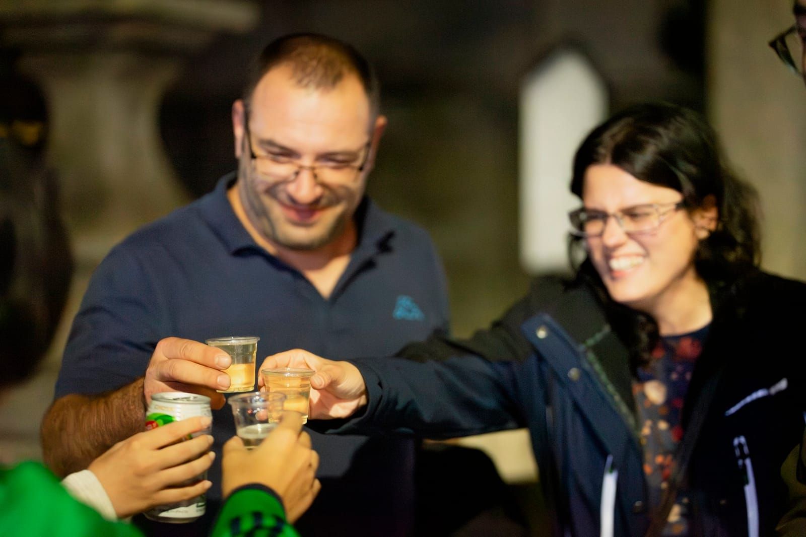 Guests toasting with sake shots
